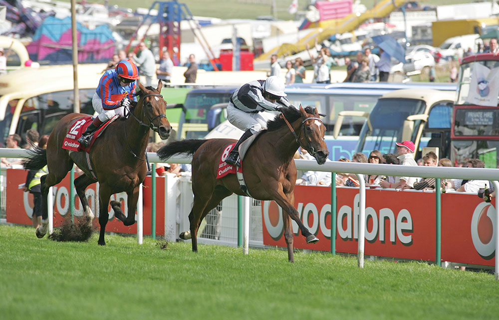Ulysses’s dam, Light Shift (rails) holds off Peeping Fawn to secure a Classic victory in the Group 1 Oaks at Epsom